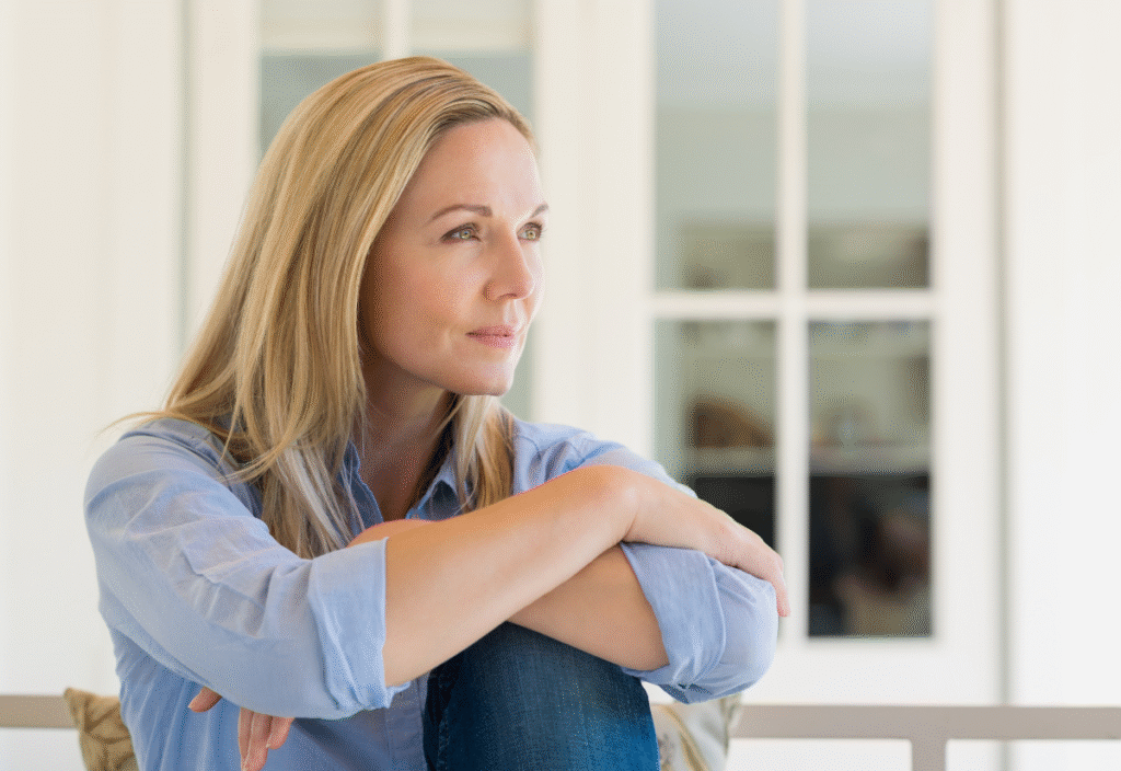 Middle-aged woman reflecting on hormonal changes and ovulation during perimenopause