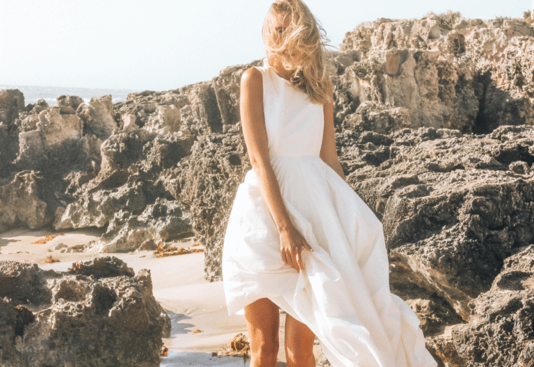 confident perimenopause woman wearing a flowy summer dress